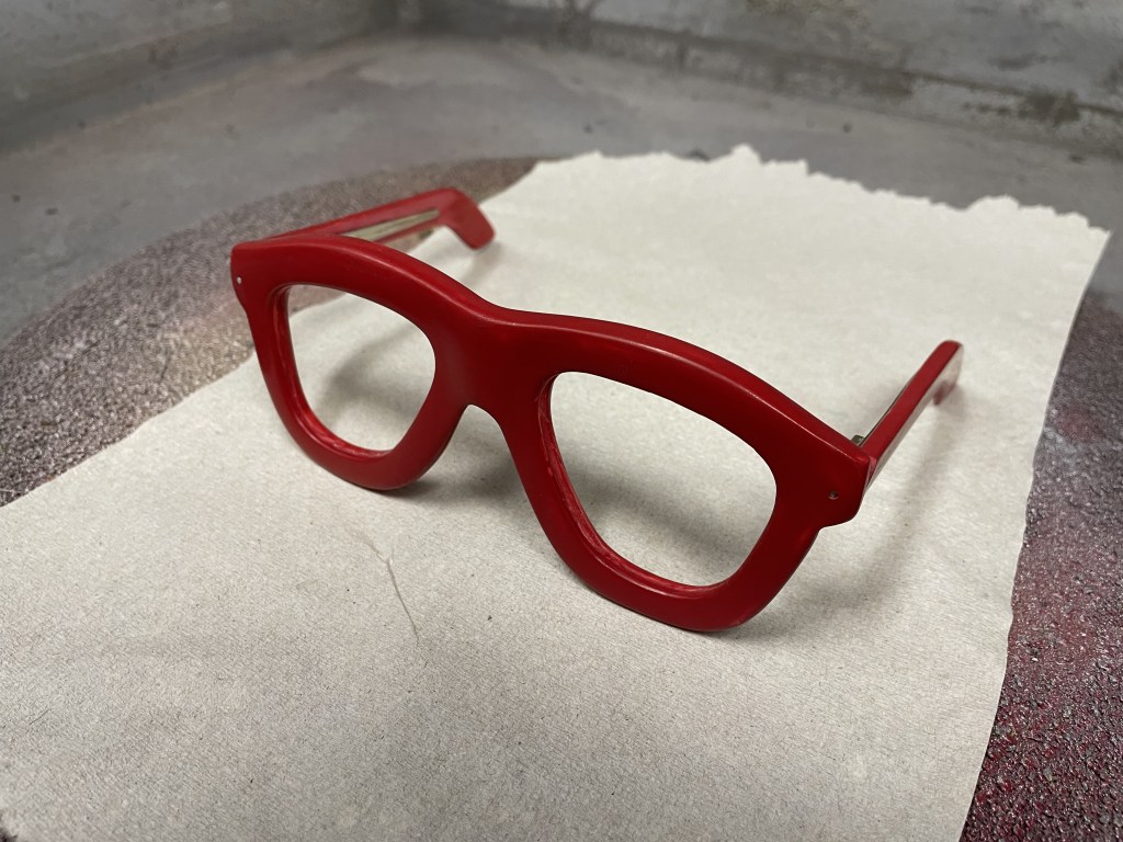 Miikshi's signature red spectacles are prepped for shooting.
