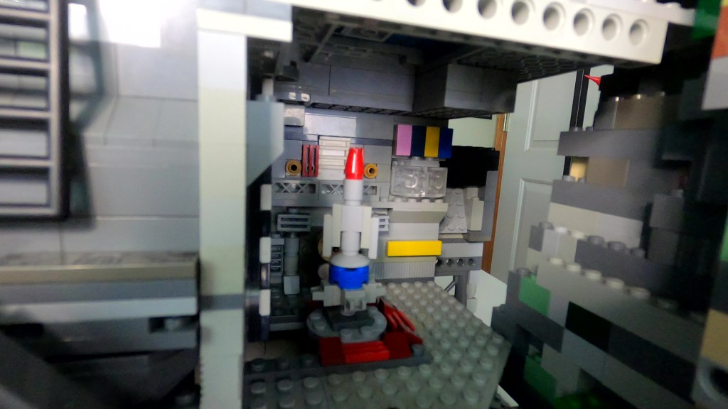 Thunderbird 1 launch bay at the bottom of the tunnel, under the pool.
