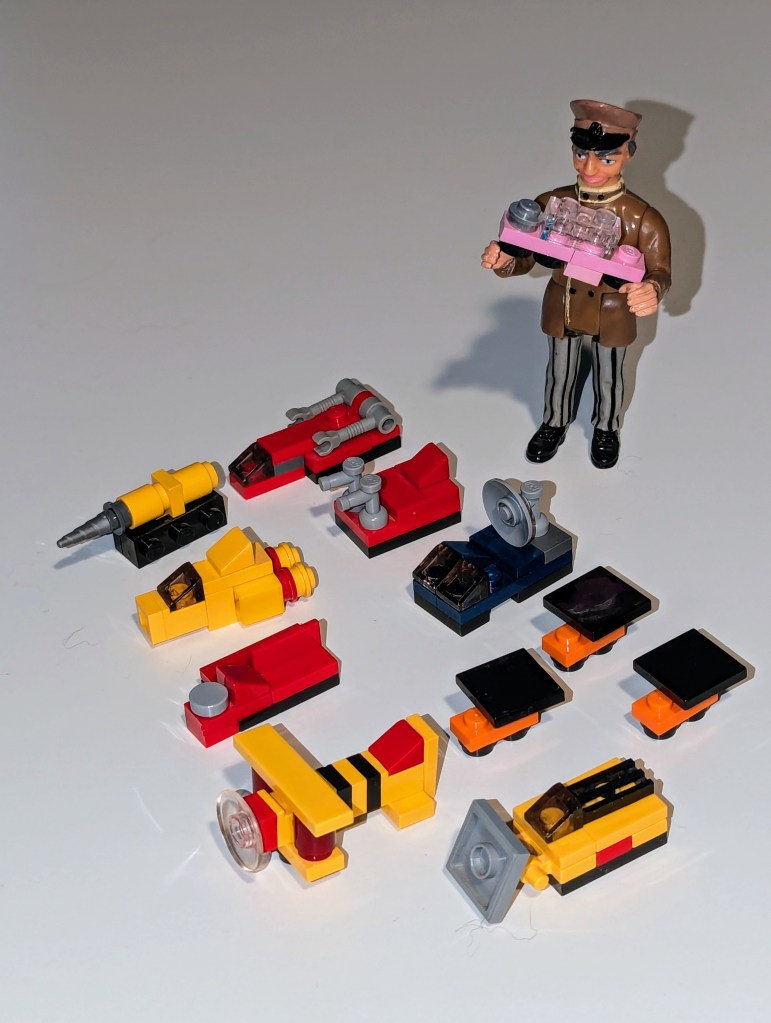 Parker handles mini LEGO pod vehicles from Thunderbirds.