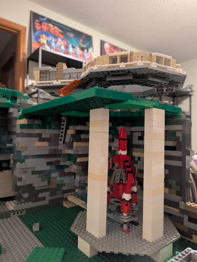 Construction begins on Thunderbird 3's silo in LEGO.